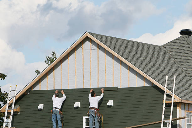 Professional Emergency Siding Repair technician working in Bellevue, OH